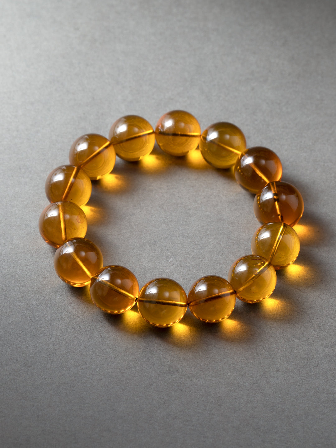 Golden-Blue Amber Bracelet · 14 mm
