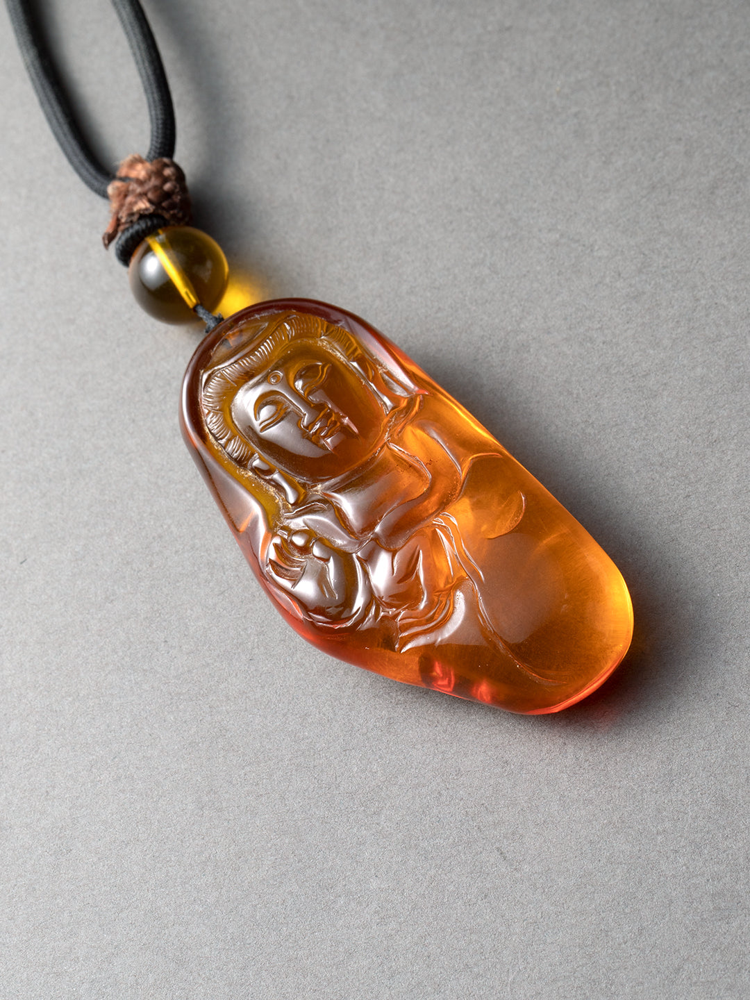 Freeform Amber Buddha Pendant