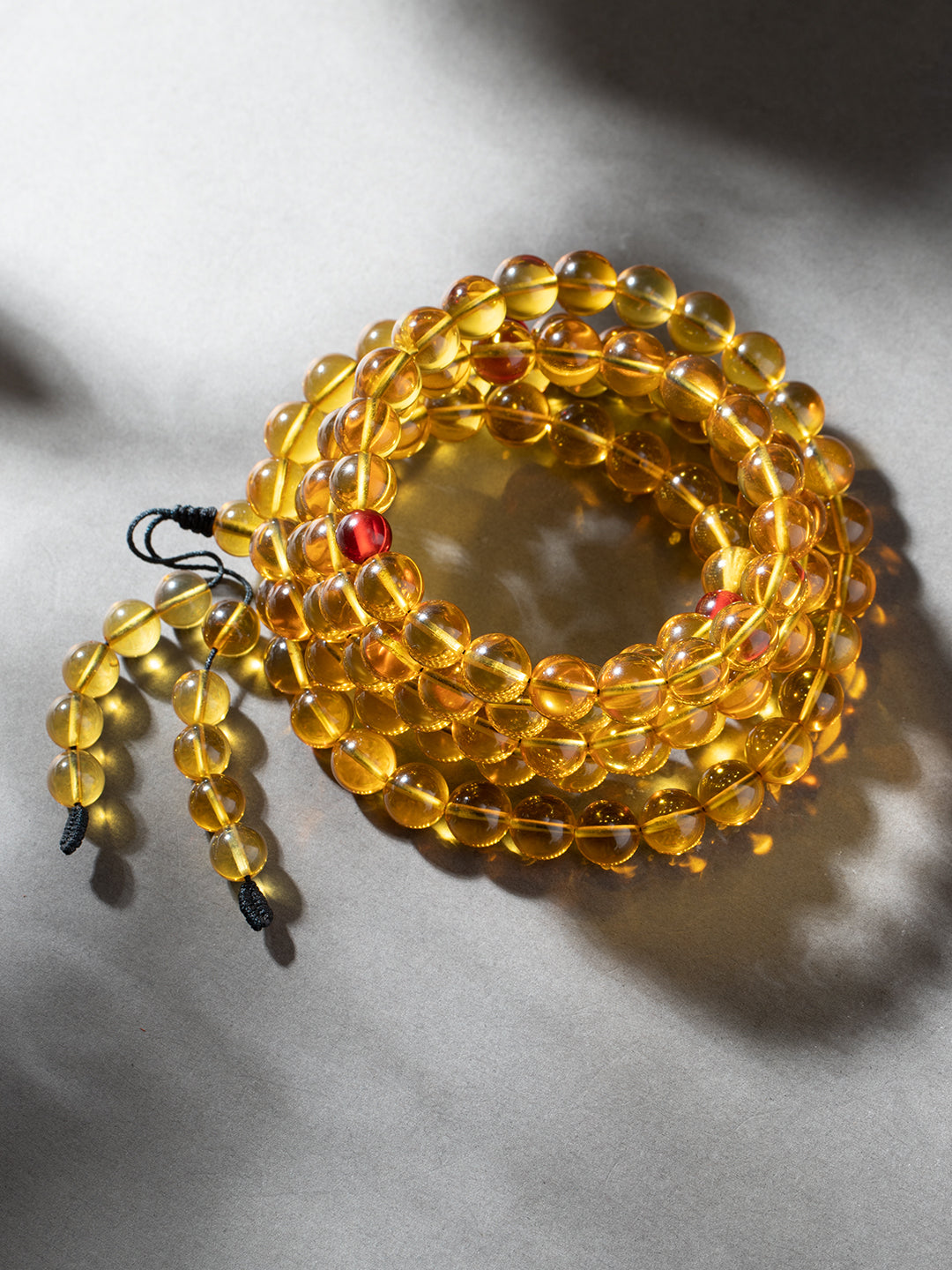 Burmese Golden-Blue Amber 108-Bead Mala · 9.5 mm
