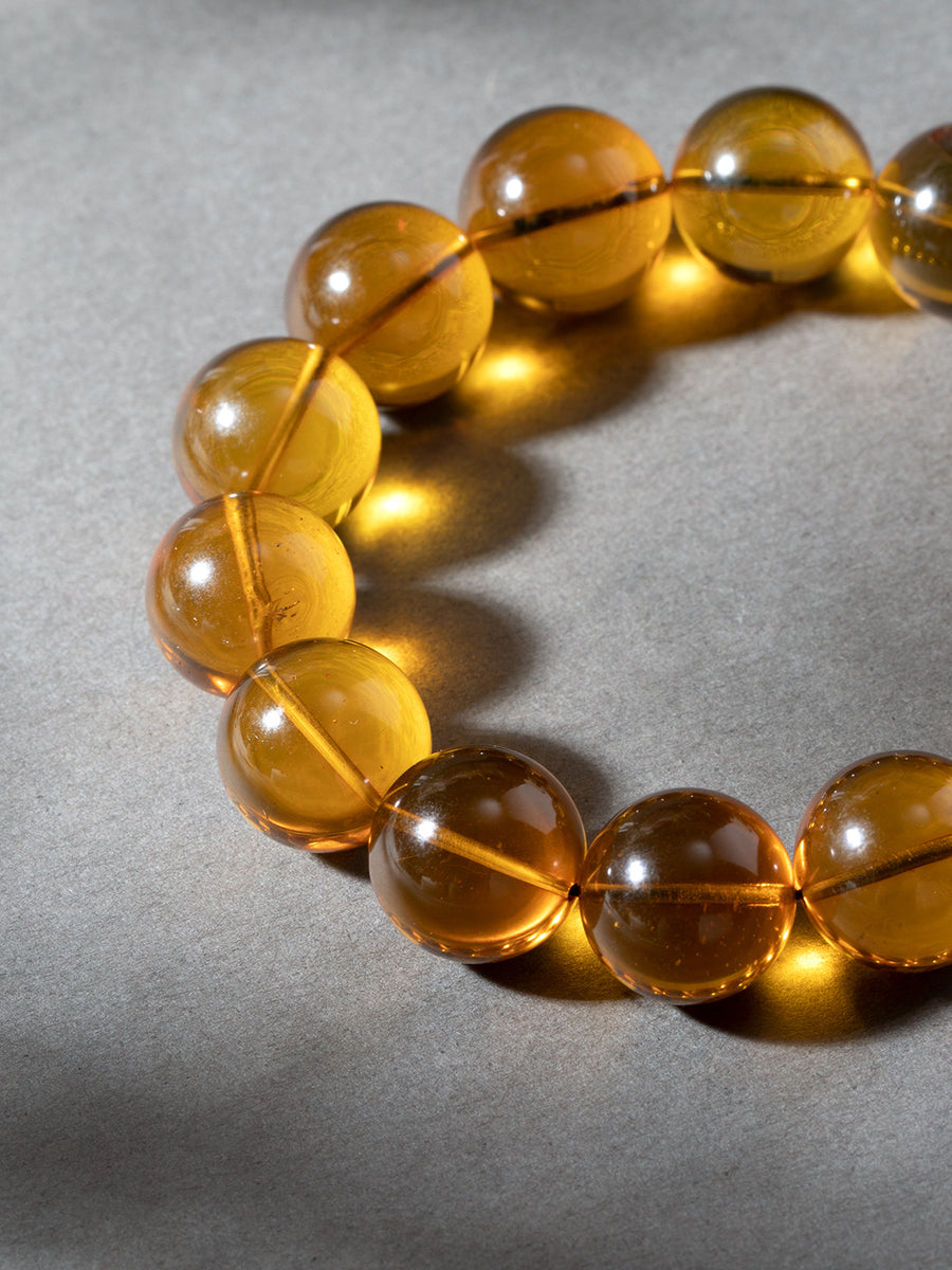 Golden-Blue Amber Bracelet · 14 mm